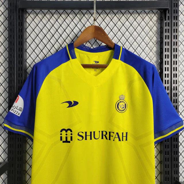 Camisa Al-Nassr I 23/24 Duneus - Amarelo e Azul - Loja da Seven Oficial