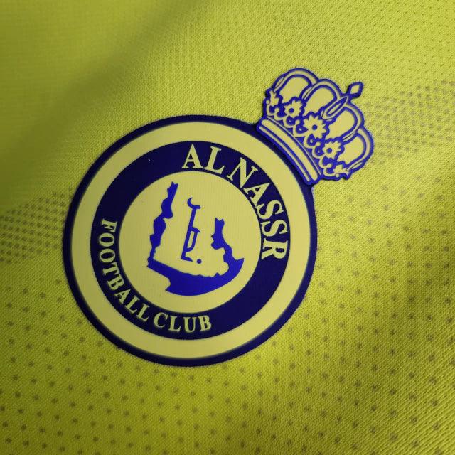 Camisa Al-Nassr I 23/24 Duneus - Amarelo e Azul - Loja da Seven Oficial