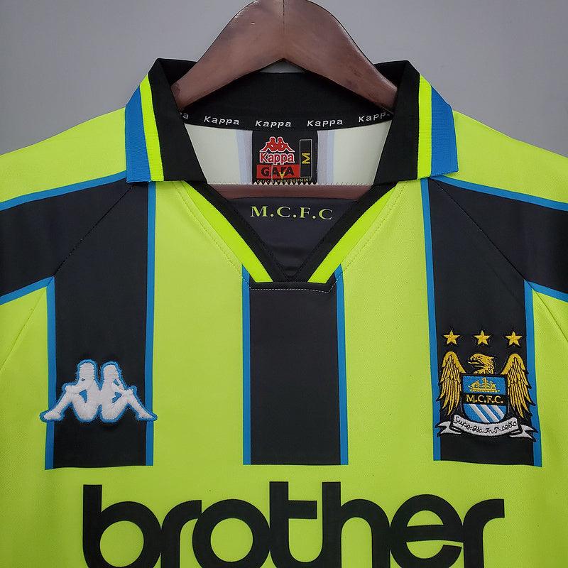 Camisa Manchester City Retrô 1998/1999 Amarela e Preta - Kappa - Loja da Seven Oficial